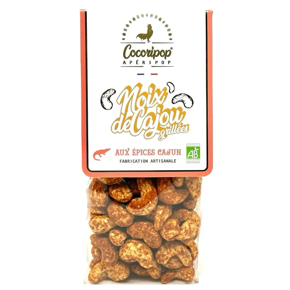 Noix de cajou aux épices cajun, Noix de cajou enrobée d’un mélange d’épices cajun, offrant des notes épicées et fumées parfaites pour l’apéritif. bio