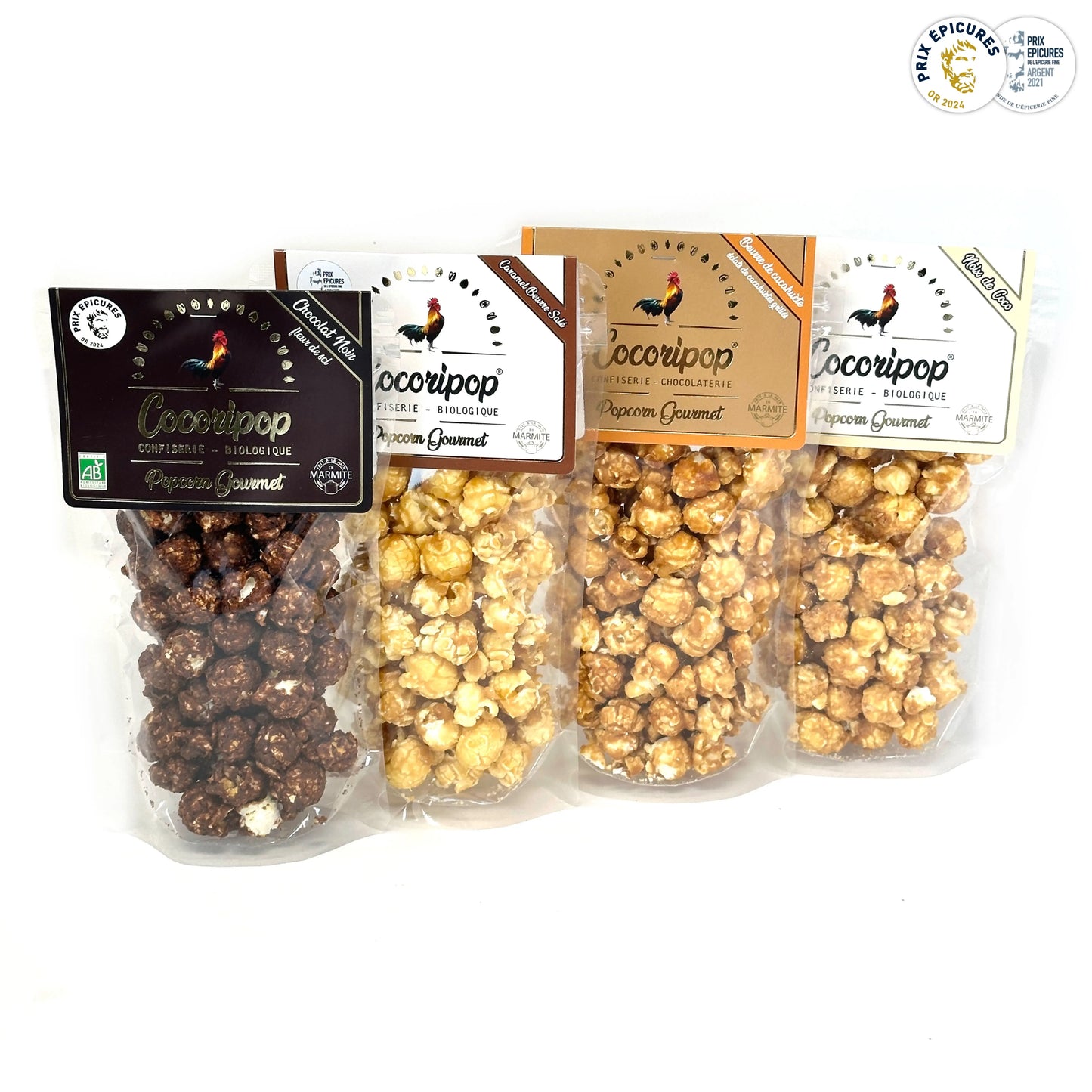 Assortiment de popcorns bio Cocoripop en mise en scène gourmande avec les 4 recettes visibles : chocolat, caramel, coco et cacahuète