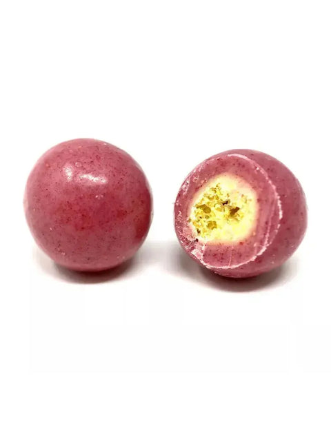 Bille soufflée croustillante enrobée de chocolat à la framboise, alliant douceur fruitée et texture légère. Bio