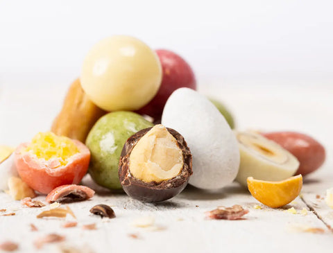 Collection de bonbons au chocolat artisanal Cocoripop : confiseries bio enrobées de chocolat noir, lait, blanc et blond, fabriquées en France.