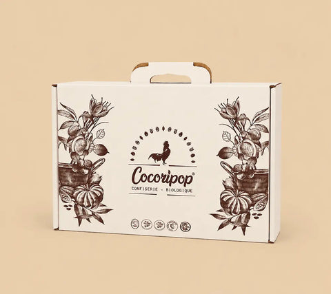 Emballage cadeau artisanal Cocoripop pour confiseries françaises biologiques, coffret gourmand premium prêt à offrir pour toutes les occasions.