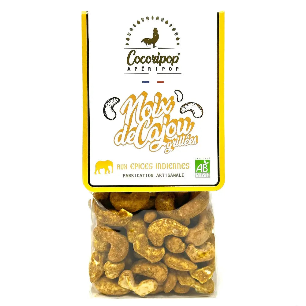 Noix de cajou grillées aux épices Indiennes Bio – noix de cajou bio croquantes et finement salées, relevées par un mélange d’épices indiennes maison, idéales pour l’apéritif, présentées sur fond blanc. bio