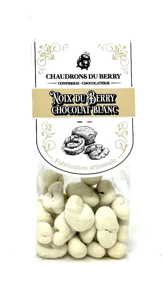 Noix du Berry au Chocolat Blanc – cerneaux de noix du Berry torréfiés et enrobés d’un chocolat blanc fondant et onctueux, une gourmandise artisanale raffinée, présentée sur fond blanc. bio