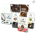 Pack Grand Mix Tout Chocolat Bio – assortiment gourmand de chocolats artisanaux incluant coffret métal trois chocolats, popcorn chocolat noir et caramel, soufflés trois chocolats, raisins chocolat noir et pralines amandes cacao, présenté sur fond blanc. bio
