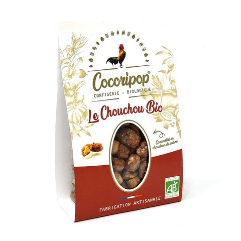 Pralines Cacahuètes Bio – cacahuètes bio de qualité, torréfiées et enrobées d’une fine coque de sucre caramélisée, préparées artisanalement en chaudron de cuivre, présentées sur fond blanc. bio