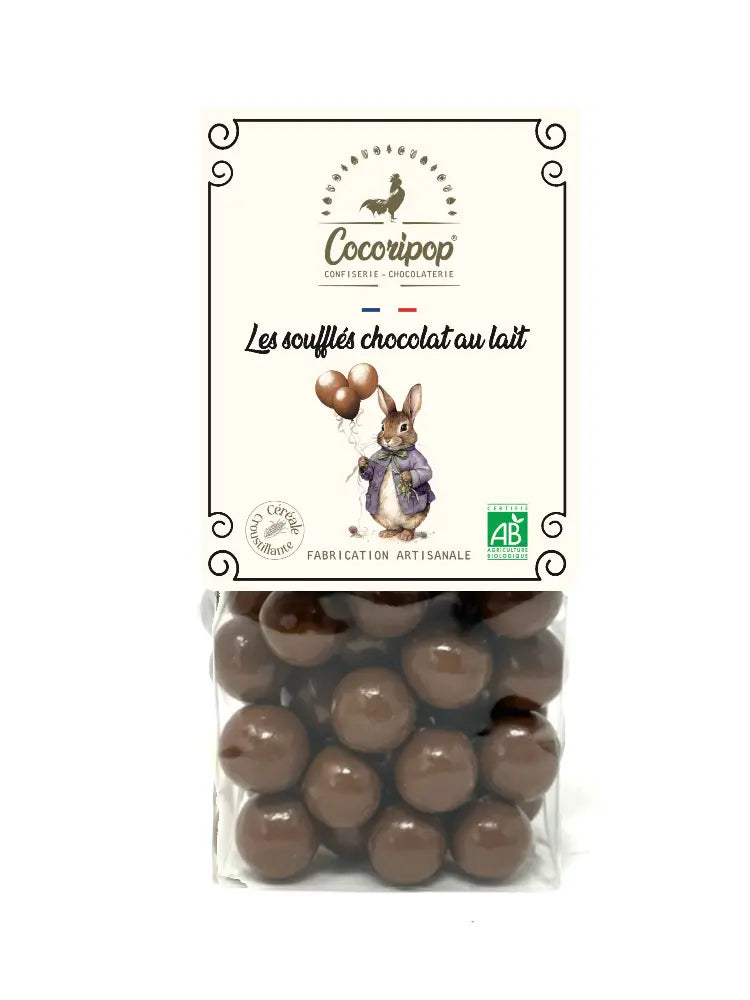 Soufflés Chocolat Lait version Lapin/Ballons "Sélection de Pâques" Bio – assortiment de billes soufflées croustillantes enrobées de chocolat au lait fondant, présenté sur fond blanc.