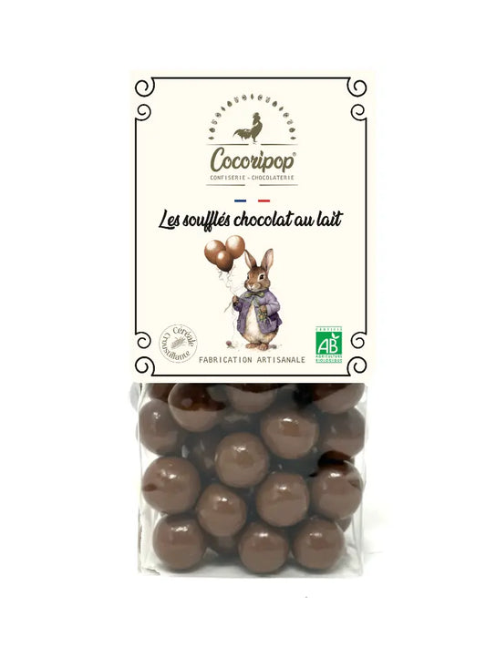 Soufflés Chocolat Lait version Lapin/Ballons "Sélection de Pâques" Bio – assortiment de billes soufflées croustillantes enrobées de chocolat au lait fondant, présenté sur fond blanc.