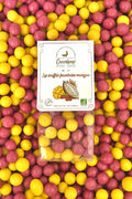 Billes de maïs soufflées enrobées de chocolat blanc bio, de framboise et de mangue, confection artisanale française à Saint-Germain-du-Puy près de Bourges.