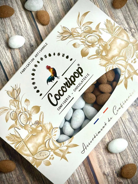 Coffret gourmand composé d'Amandes des Neiges bio et d'Amandes Truffées Cacao bio, fabrication artisanale française à Saint-Germain-du-Puy.