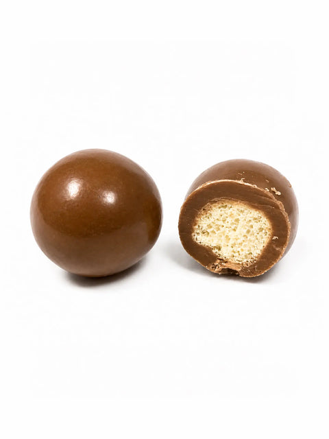 Confiserie artisanale française aux billes de maïs croustillantes enrobées de chocolat au lait bio, fabrication à Saint-Germain-du-Puy