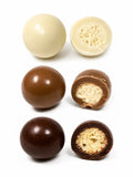 Confiserie artisanale française aux billes de maïs croustillantes enrobées de trois chocolats bio, fabrication à Saint-Germain-du-Puy dans le Cher