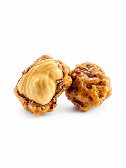 Noisettes bio caramélisées, spécialité artisanale française élaborée à Saint-Germain-du-Puy près de Bourges, proposées en vrac pour les épiceries fines.