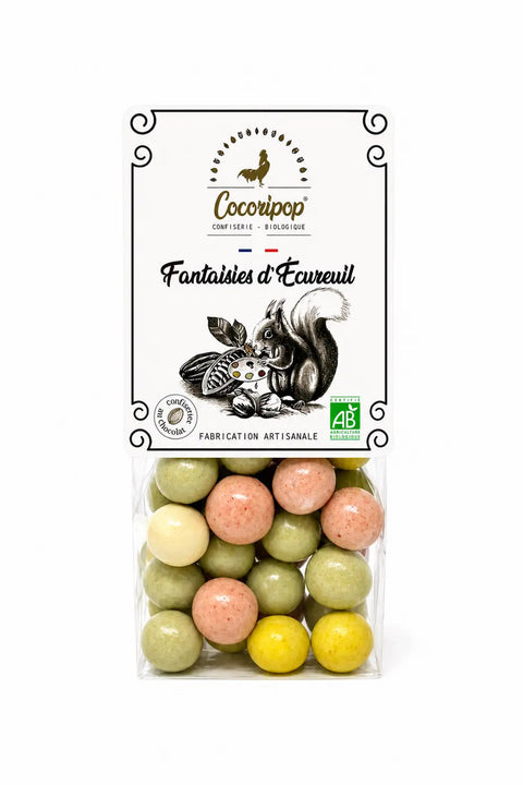 Fantaisies d'Écureuil bio, noisettes torréfiées enrobées de chocolats blanc et lait bio, fabriquées artisanalement près de Bourges dans le Berry.
