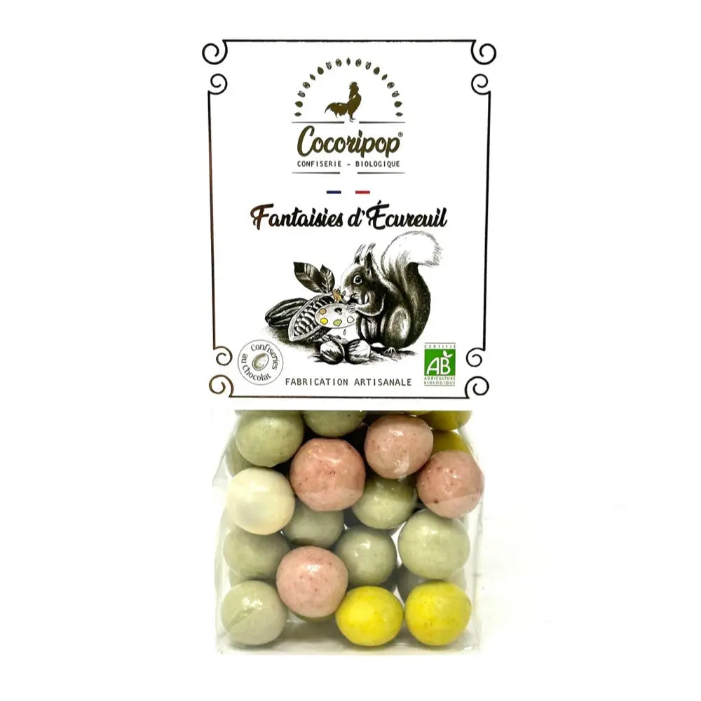 Fantaisie d’écureuil, Noisettes enrobées de chocolat blanc et chocolat au lait, sublimées par des colorants naturels issus de fruits et légumes, une confiserie colorée et gourmande. bio