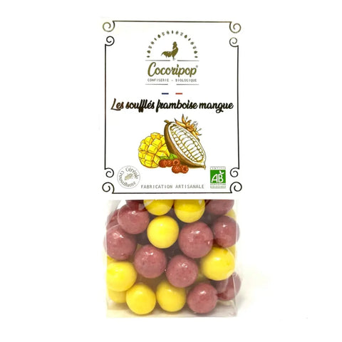 Soufflés duo mangue, billes  croustillantes enrobées de chocolat blanc et parfumées à la mangue et à la framboise, une explosion fruitée et chocolatée. bio
