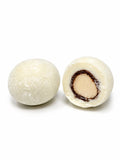Confiserie artisanale française aux noisettes croquantes enrobées de chocolat blanc bio et noix de coco râpée, fabrication à Saint-Germain-du-Puy dans le Cher
