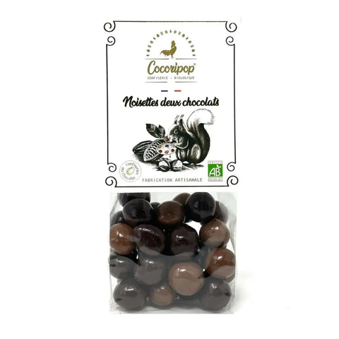 Noisettes deux chocolats, Noisettes torréfiées croquantes enrobées de chocolat noir et chocolat au lait, une alliance parfaite entre intensité et onctuosité. bio