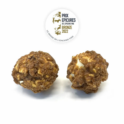 Assortiment de popcorns bio haut de gamme associant caramel, chocolat noir, fleur de sel et café pour une dégustation croustillante, authentique et gourmande.
